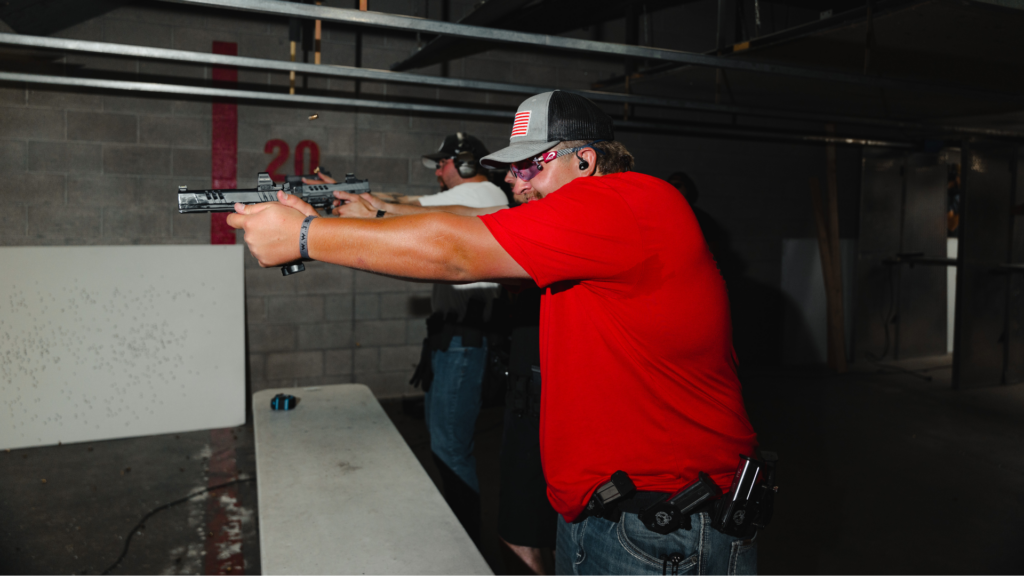 Image of two shooters competing at Tactical Penguin League Night.